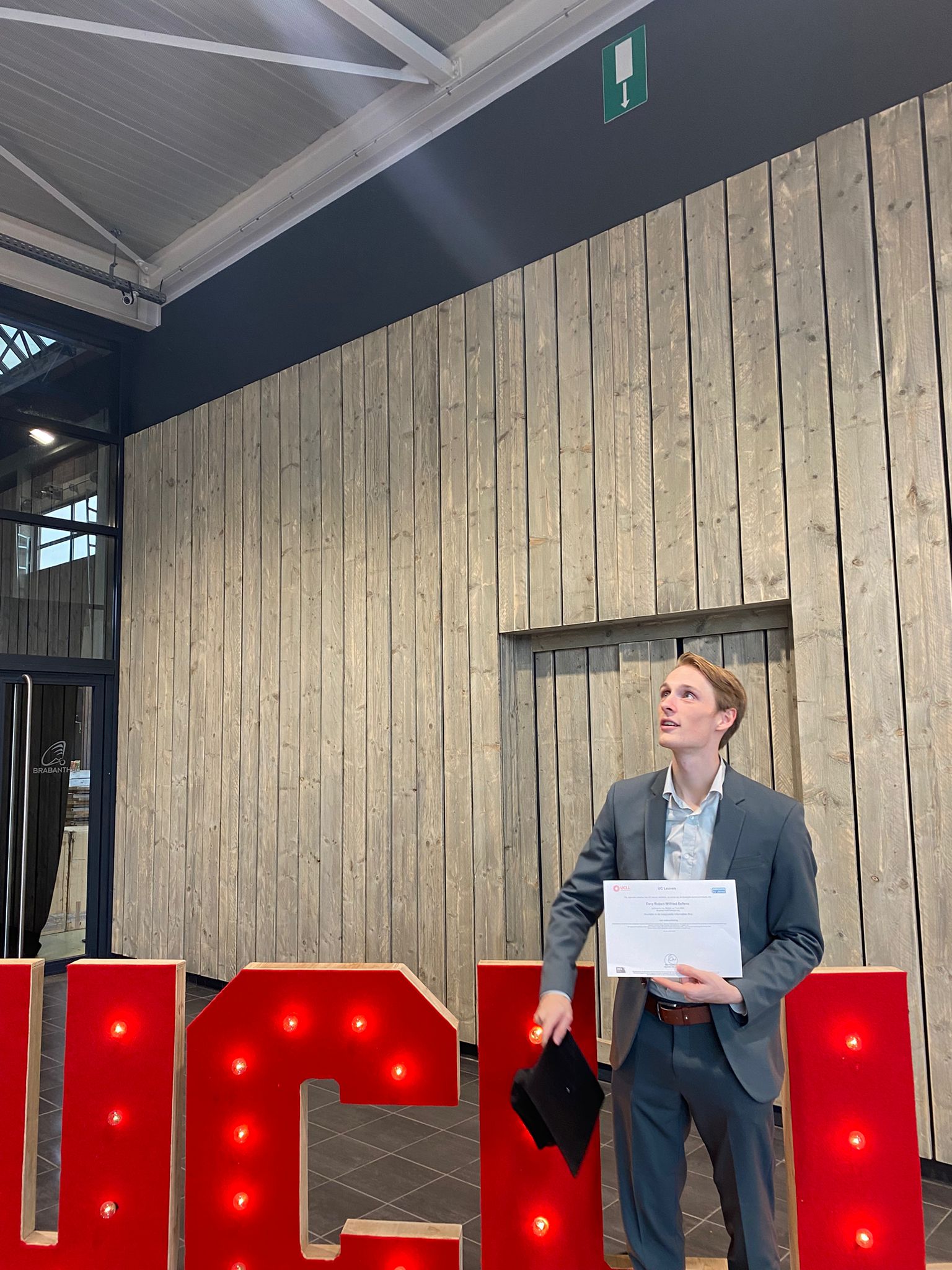 A picture of me about to throw my academic cap into the air.