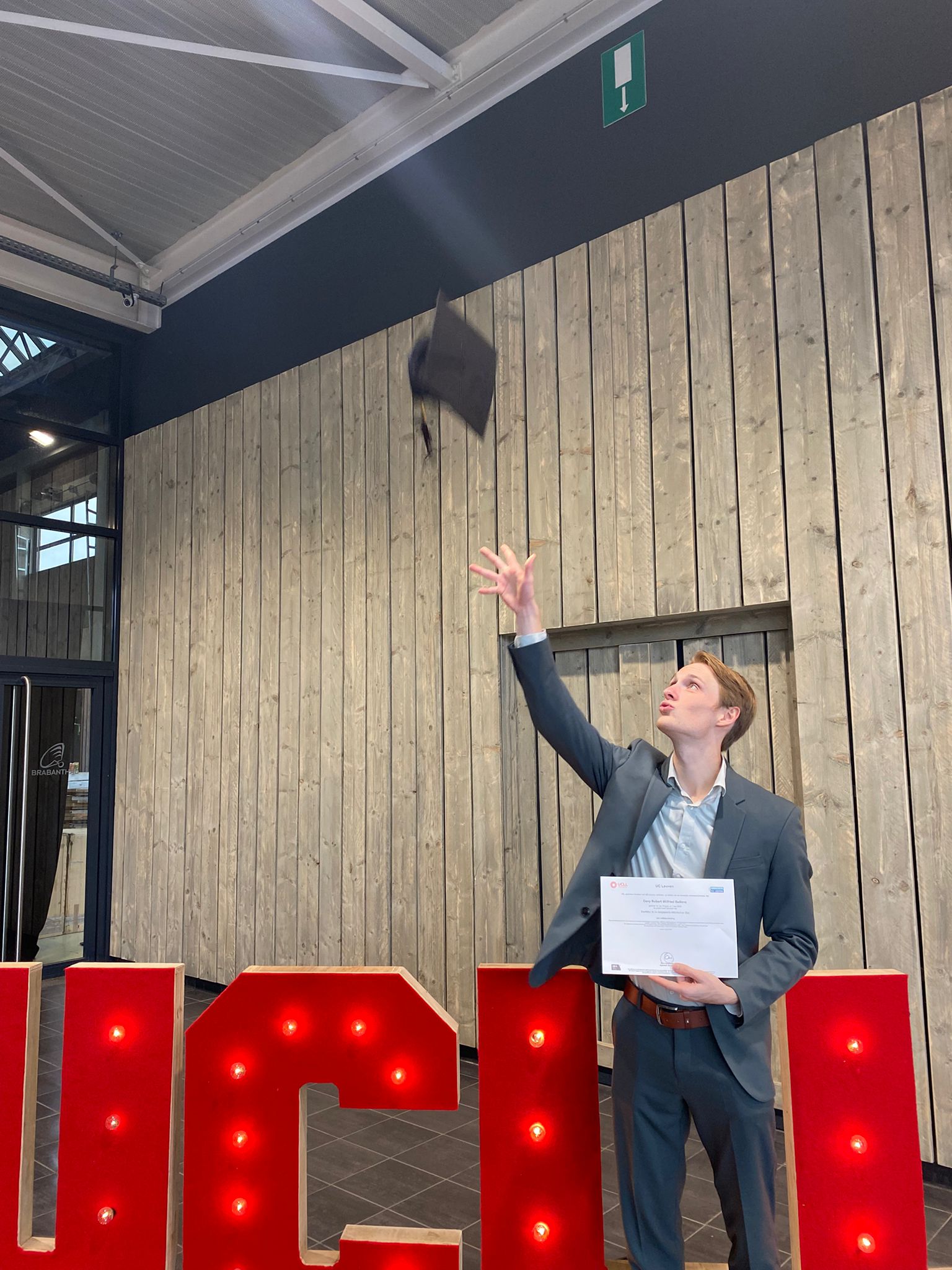A picture of me throwing my academic cap into the air.